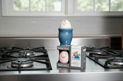 BeepEgg Chicken and Pig editions in packaging on a wooden surface