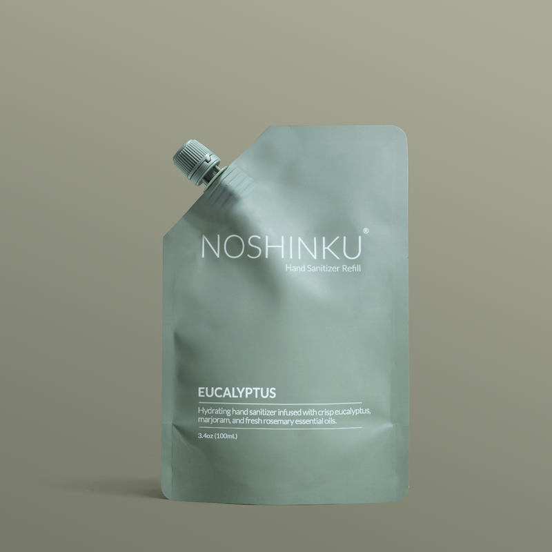 Noshinku eucalyptus hand sanitizer refill pouch on a beige background