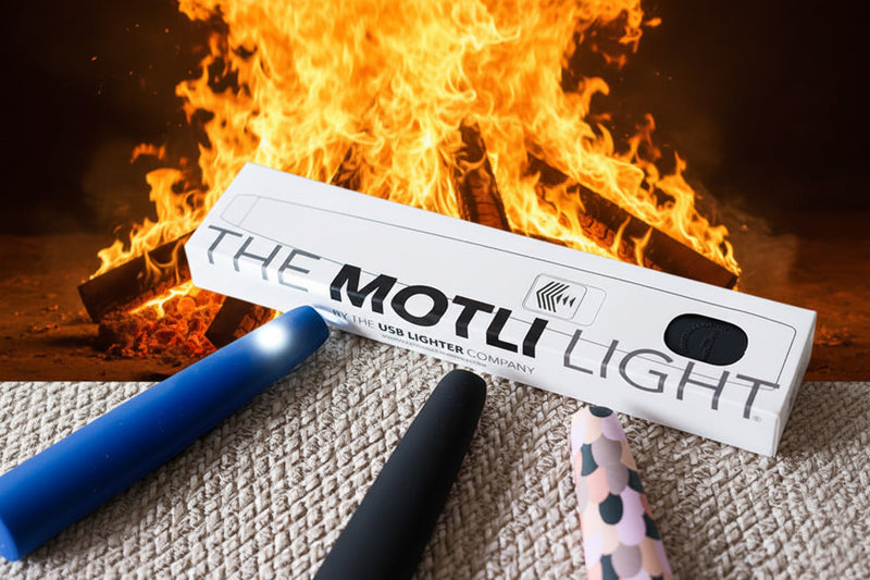 Motli USB lighter packaging with three lighters on a textured surface with  bonire