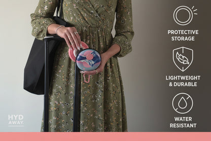Person holding a colorful round case with product features listed on a gray background