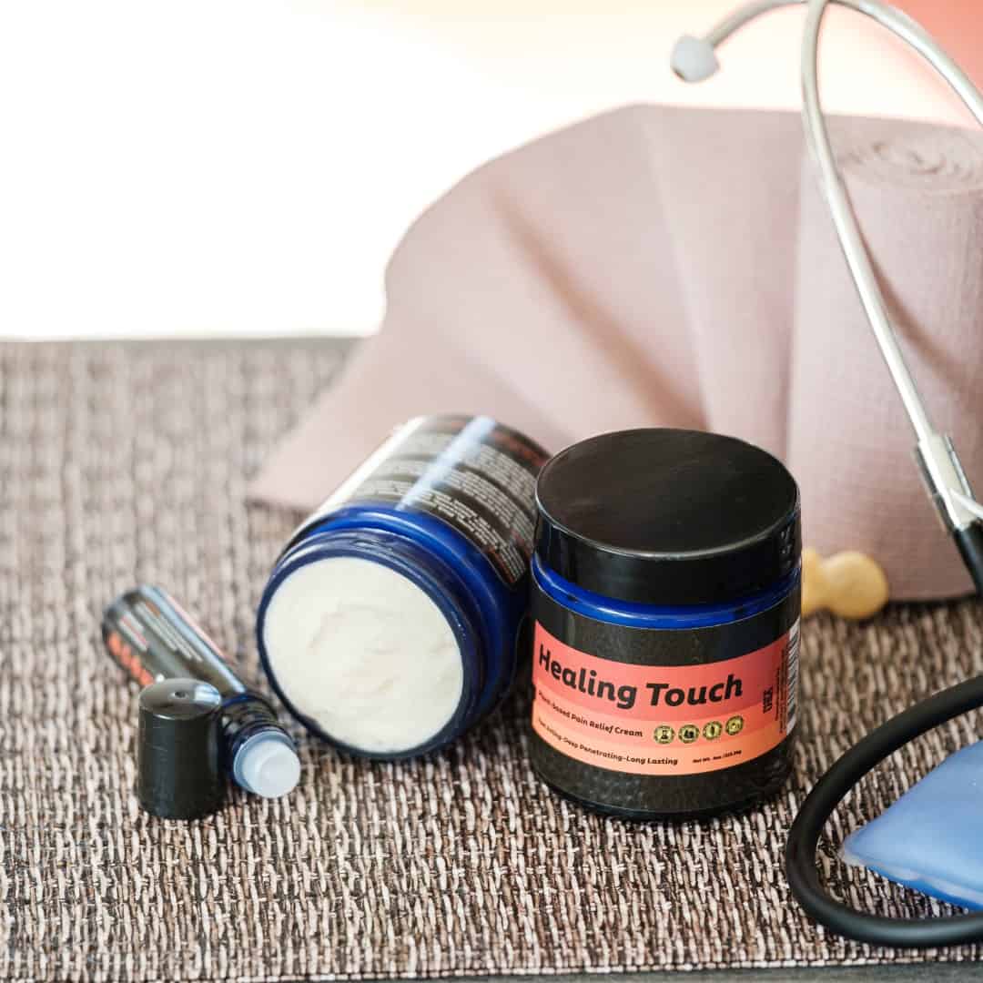 Cosmetic jar labeled 'Healing Touch' with a stethoscope on a textured surface.