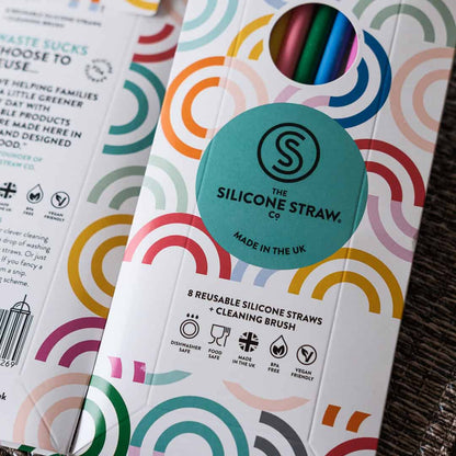 Silicone straw packaging with colorful design and brand logo.