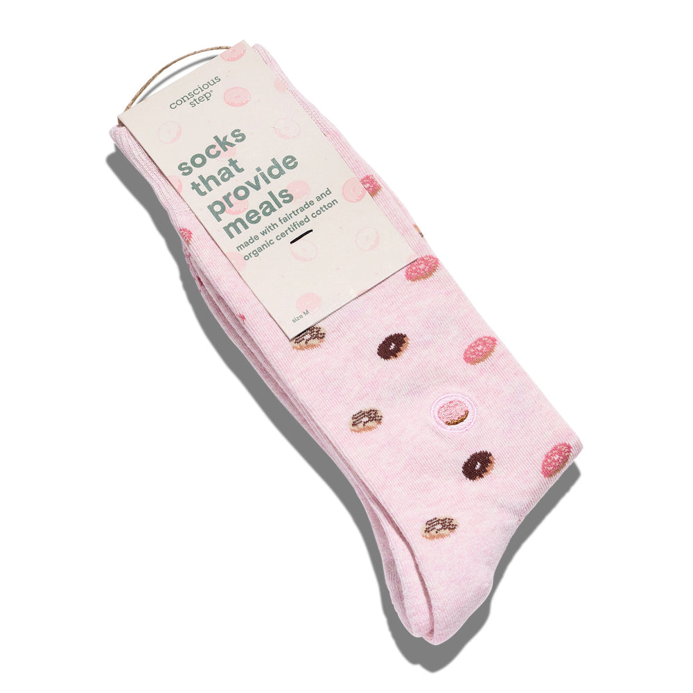 Pink socks with donut design and packaging on a white background