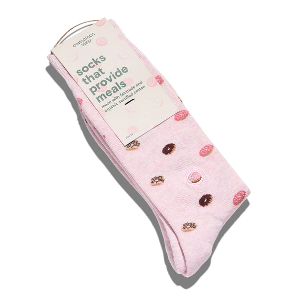 Pink socks with donut design and packaging on a white background